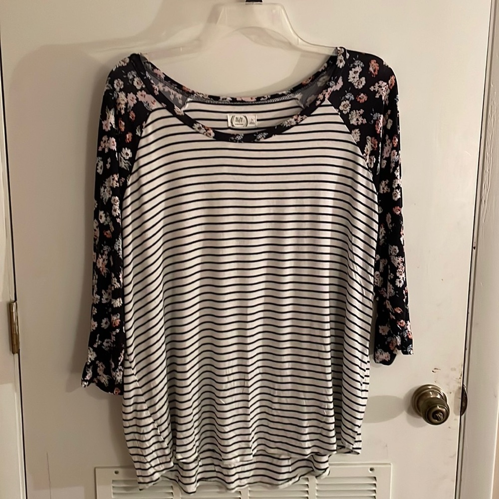Black and white striped top with floral 3/4 sleeve.